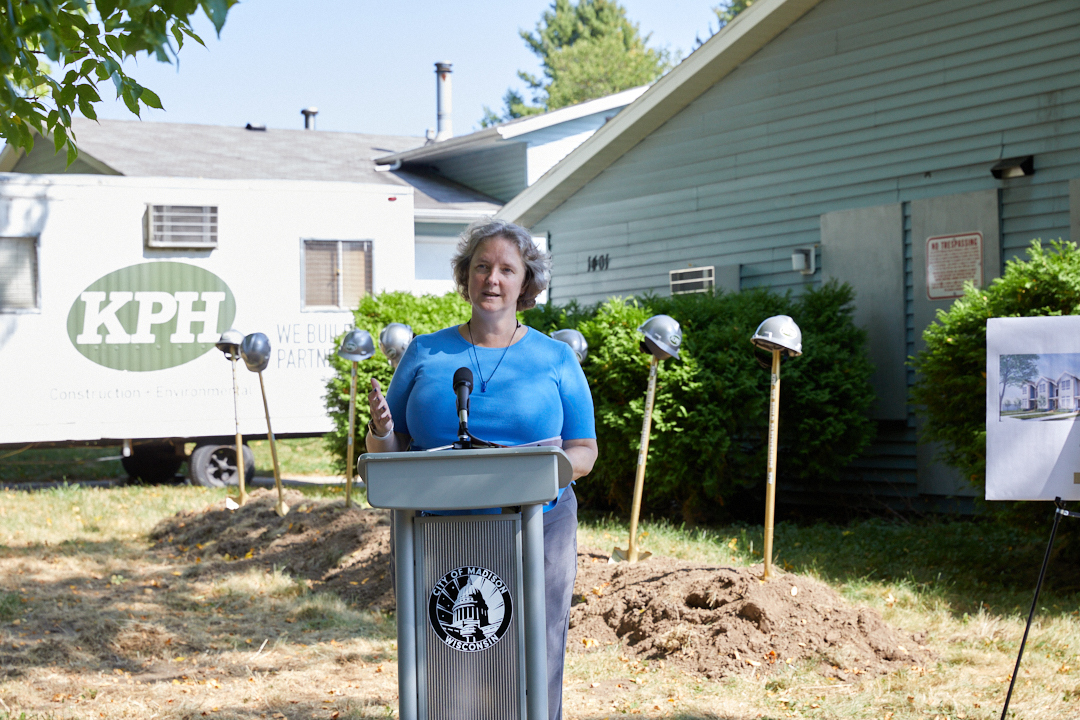 a woman standing at a podium