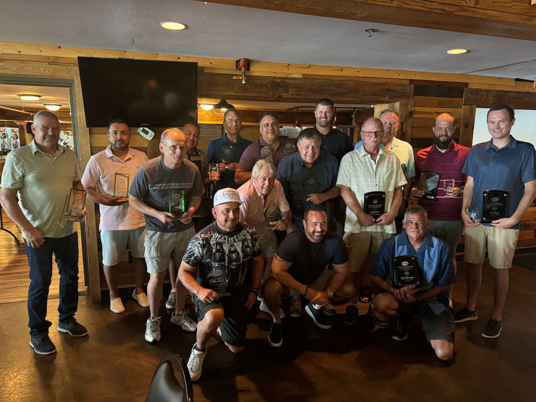 a group of men posing for a photo