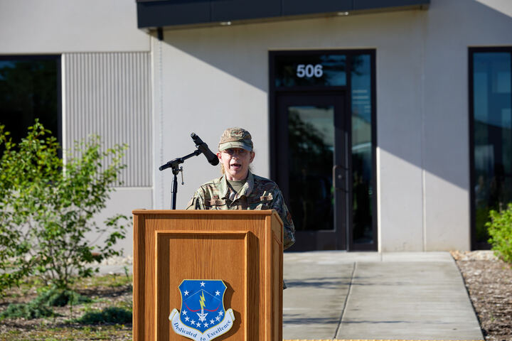 a man in military uniform standing at a podium