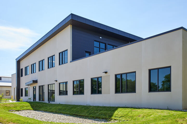 a building with grass and windows